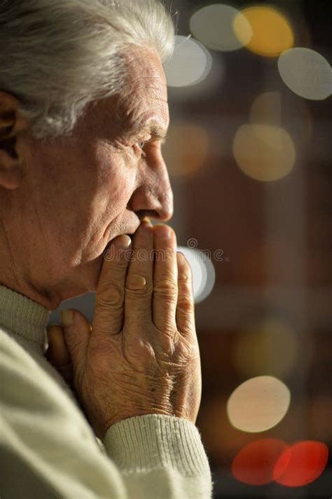 Sad Upset Mature Hispanic Guy In Yellow Pullover Looking With Guilt And