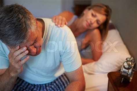 Wife Comforting Husband Suffering With Insomnia Stock Image Colourbox