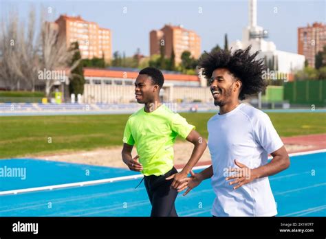 Horizontal Photo With Motion Of Two African American Young Runners In