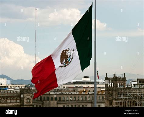 Large Mexican Flag Flying Above Zocalo In Mexico City Against Backdrop