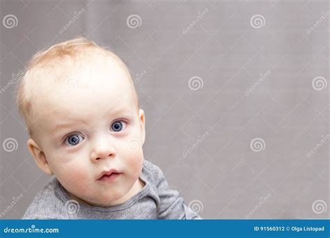 Blue Eyed Baby Boy Looking At Camera With Reproach Open Eyed Cute