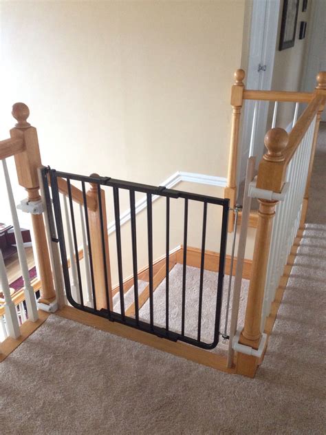 Safety Gate At The Top Of A Staircase With No Holes In The Banisters