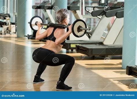 Woman Doing Squats Stock Photo Image Of Determination