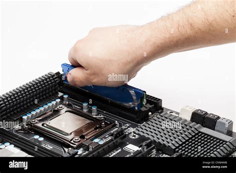 Memory module installation on a computer motherboard Stock Photo - Alamy