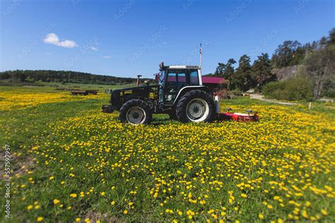 Tractor with a disc harrow system on the cultivated farm field, process ...