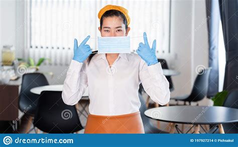 Attractive Asian Waitress Wear Face Mask To Protection Epidemic Virus