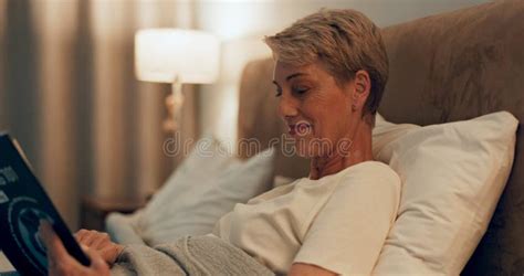 Online Tablet And Mature Woman In Bed At Night For Social Medial