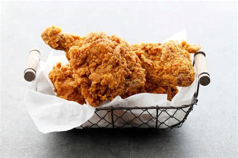 Premium Photo Homemade Crispy Fried Chicken On Wire Basket Isolated On White Close Up