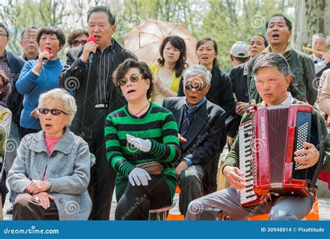 People Singing Revolutionary Songs In Fuxing Park Shanghai China