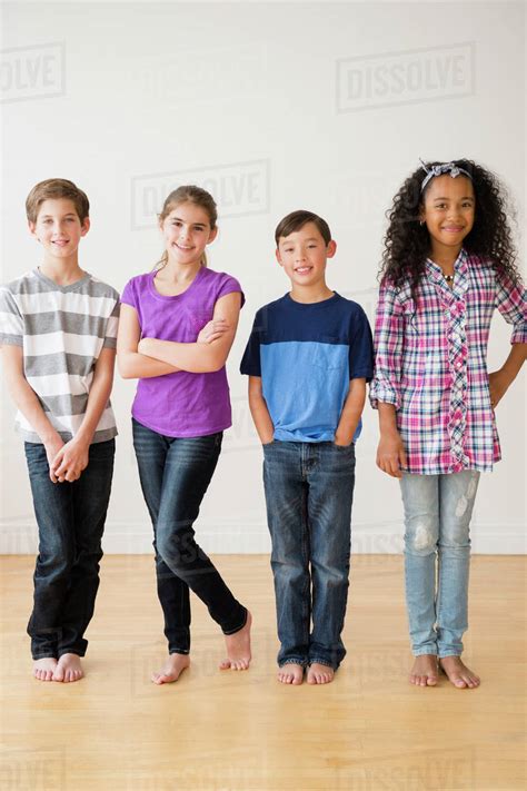barefoot children smiling  studio stock photo dissolve