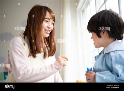 Smiling Nursery School Teacher And Children Stock Photo Alamy