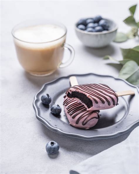 Cappuccino Or Latte With Milk Foam In A Cup With Handmade Berry Cakes