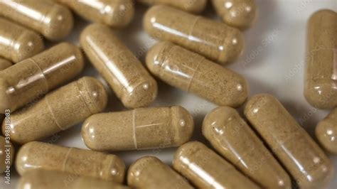 Transparent Capsules With Light Brown Powder Inside Extreme Close Up