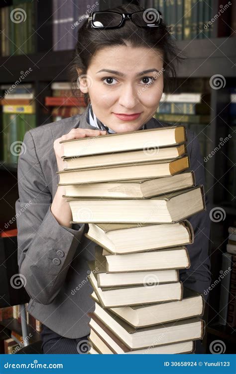 Portrait Of Beauty Young Woman Reading Book In Library Stock Photo