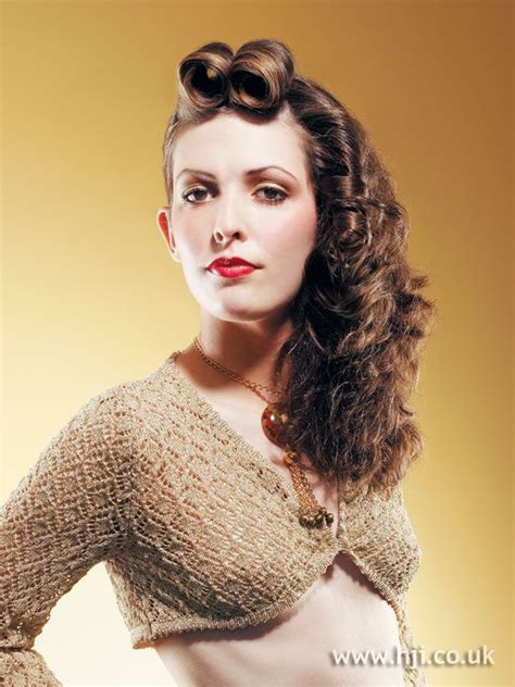 Curly Brunette Updo With Braid Detail And Victory Rolls