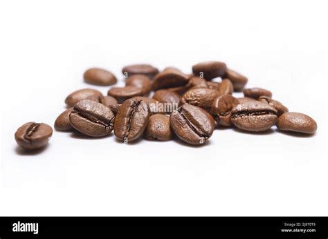 Pile Of Beans Of Medium Roast Coffee On A White Background Arabica