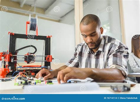 Clever Male Engineer Designing Three Dimensional Printing Machine Stock