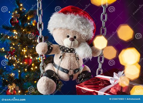 A Teddy Bear In A Santa Claus Hat Is A Christmas T For Bdsm Games On