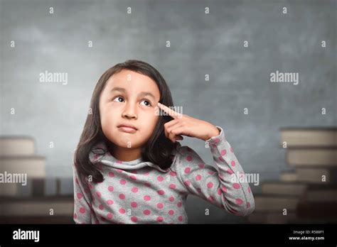 Funny Asian Kid Thinking For New Inspiration Stock Photo Alamy