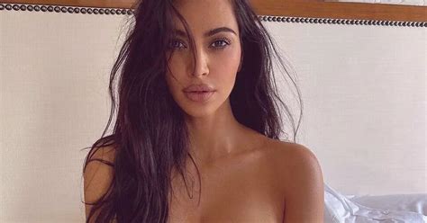 Kim Kardashian Poses Nude In Bed For Scorching Snap As She Escapes To