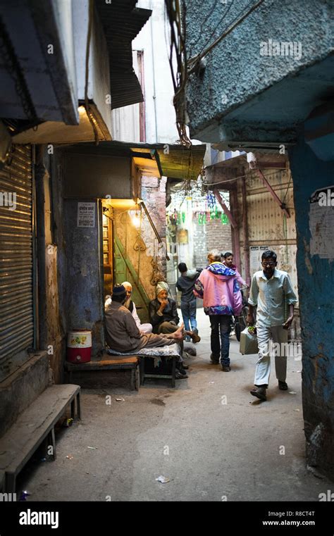 Daily life on the streets of Old Delhi at sunset. Old Delhi is a walled ...