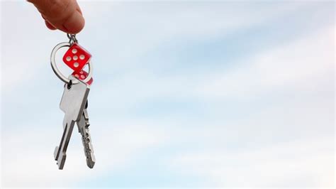 Free Photo Hand Holding Keys Outdoors