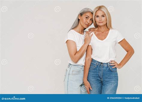 Mature Happy Multiracial Women Wearing T Shirts Posing At Camera Stock Photo Image Of Pose