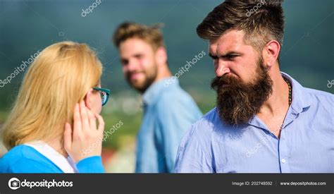 Husband Strictly Watching His Wife Looking At Another Guy While Walk