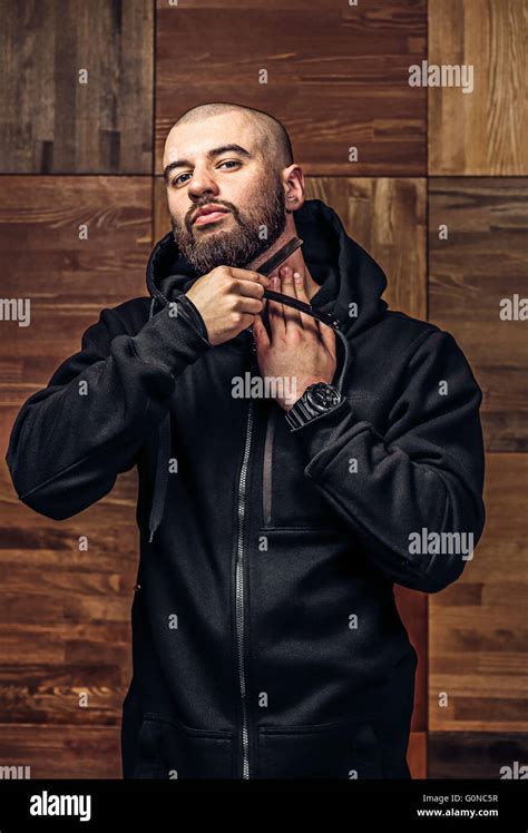 Portrait Of Brutal Bald Man With Vintage Straight Razor Stock Photo Alamy