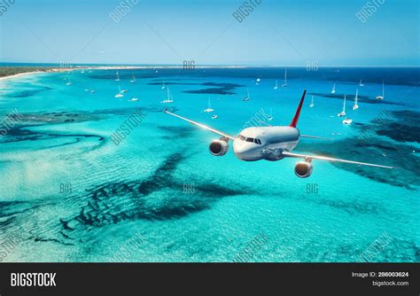 Airplane Flying Over Image Photo Free Trial Bigstock