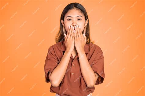 Premium Photo Portrait Of Asian Woman Covering Her Mouth With Hands