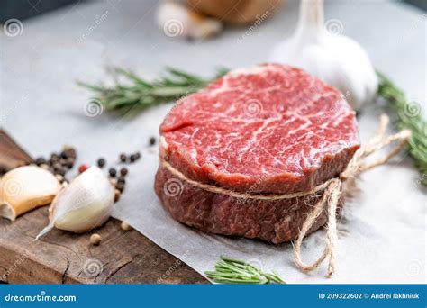 Raw Beef Filet Mignon Steak On A Wooden Board Stock Photo Image Of