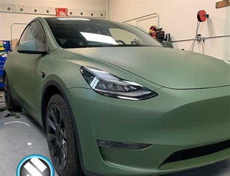 Tesla Wrapped in Avery Dennison Satin Khaki Green Vinyl - Vinyl Wrap ...