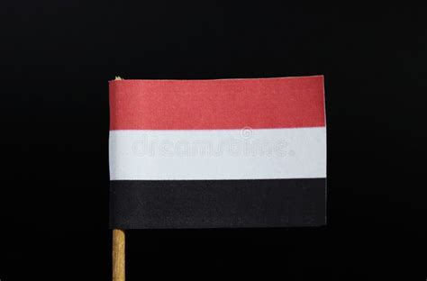 The National Flag Of Yemen On Toothpick On Black Background A