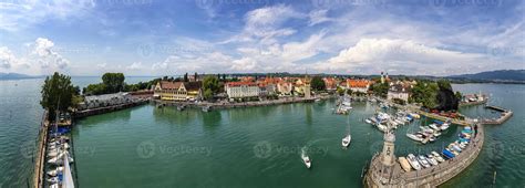 Amazing Panorama Of Harbor On Lake Constance With A Statue Of A Lion At