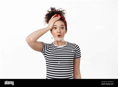 Shocked Brunette Woman Gasp Holding Hand On Head And Stare Startled At