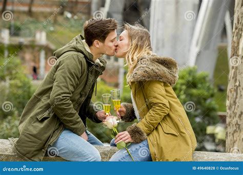 Couple In Love Kissing Tenderly On Street Celebrating Valentines Day Or