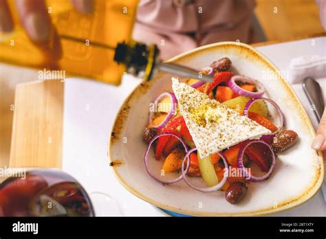 Female Hand Pouring Olive Oil On Cheese Stock Photo Alamy