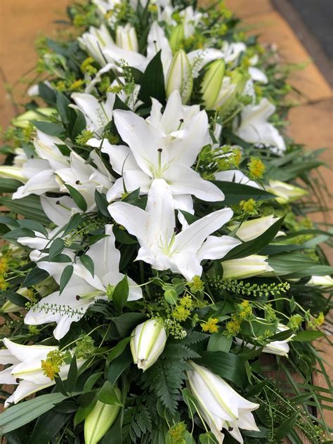 White Lily Casket Spray Casket Tributes Vanilla Blue Flowers