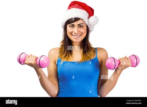 Festive Fit Brunette Holding Dumbbells On White Background Stock Photo