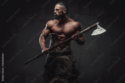 Furious And Bearded Viking Warrior With Naked Torso And Huge Biceps Prepared To Fight Holding