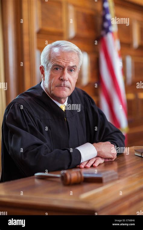 Judge Sitting At Judges Bench In Court Stock Photo Alamy