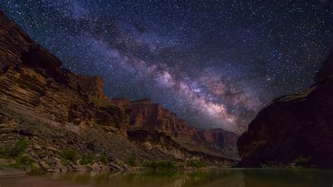 Milky Way Spanning Over Grand Canyon And Colorado River Arizona USA