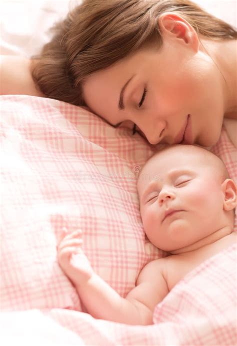 Young Mother And Her Baby Sleeping Together Stock Photo Image Of