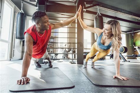 Fit Man And Woman In Gym Exercising Abs Stock Image Colourbox