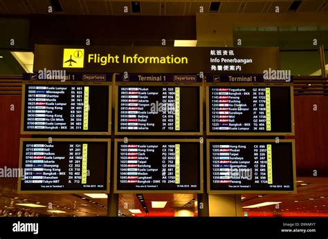 Departures flight information board: Singapore Changi Airport Stock ...