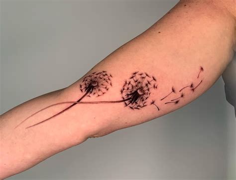 Blowing Dandelion Tattoo On Shoulder Blade