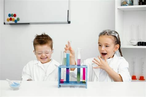 Free Photo Young Child Scientists With Safety Glasses Doing