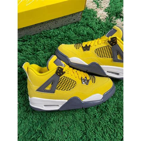 Nike Air Jordan 4 Retro Gs Tour Yellow Lightning Depop