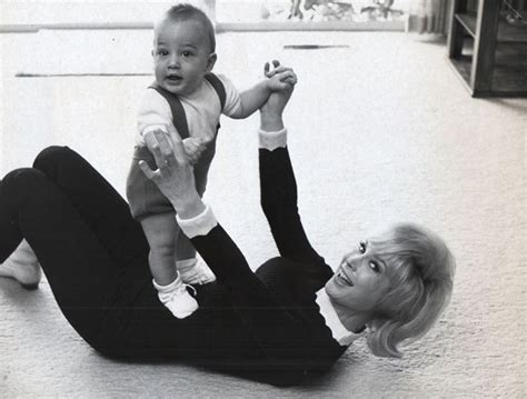 Actress BARBARA EDEN photographed playing with her son Matthew Ansara ...